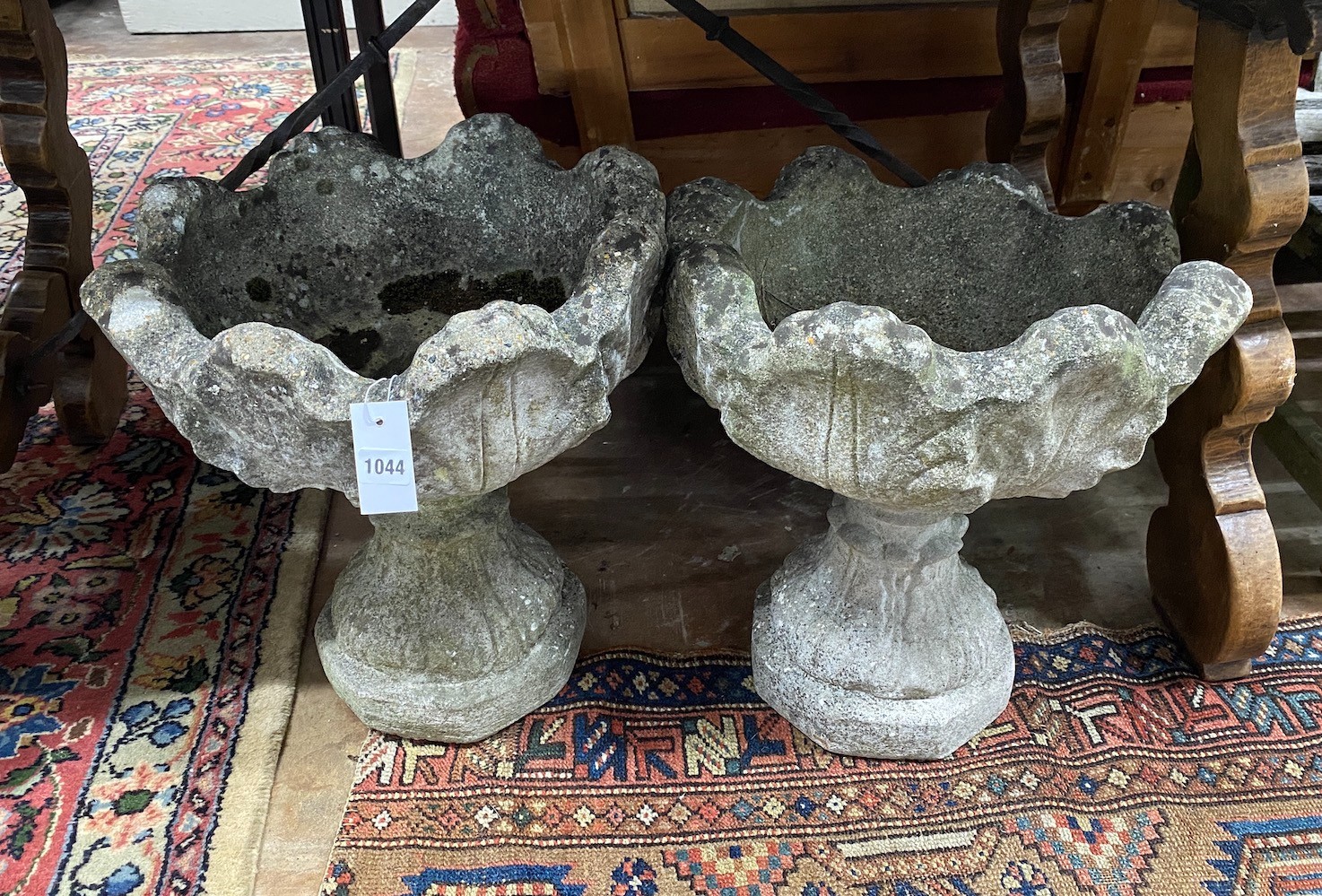 A pair of reconstituted stone garden planters, width 44cm height 48cm